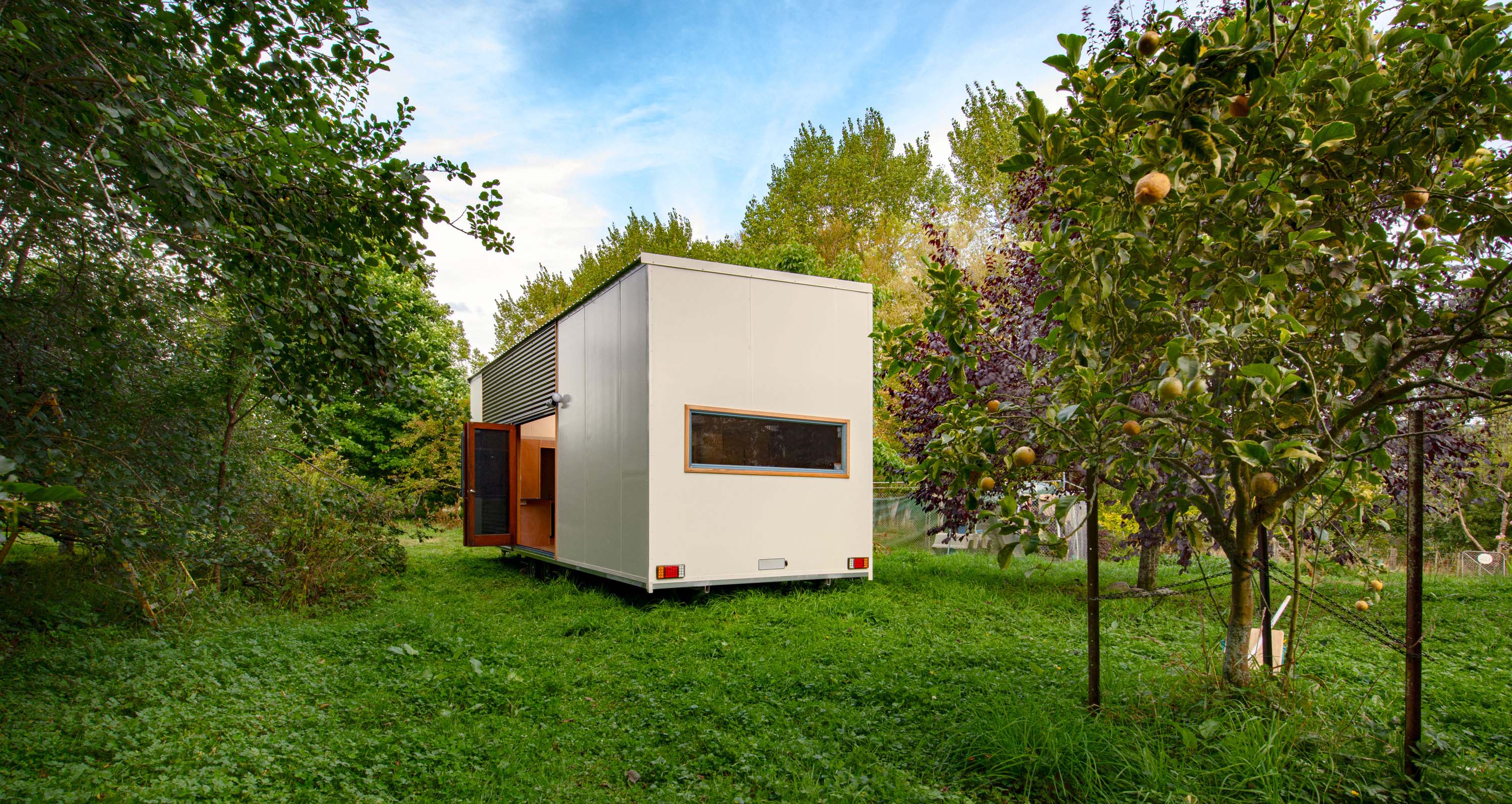 Chateau tiny home, with upstairs bedroom, large lounge and kitchen.